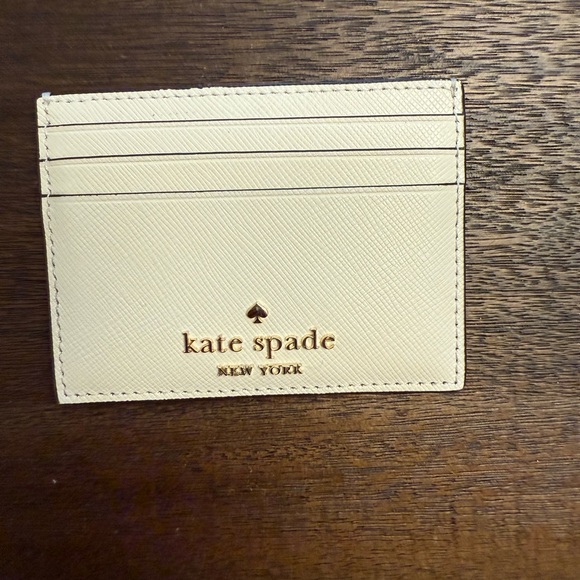 Kate Spade Cream Card Holder with Gold Logo - Picture 1 of 3